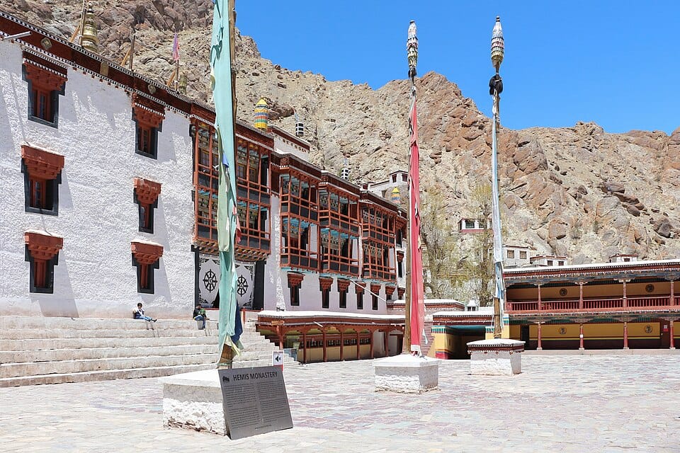 The colorful and historic courtyard of Hemis Monastery, showcasing traditional Tibetan Buddhist architecture.