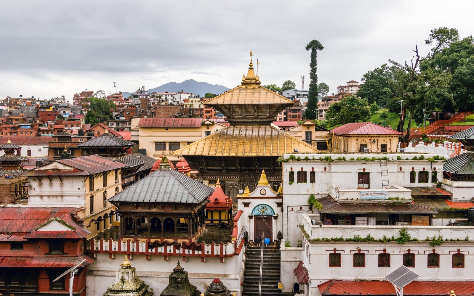 The golden-roofed Pashupatinath Temple with its pagoda architecture on the banks of the Bagmati River in Kathmandu