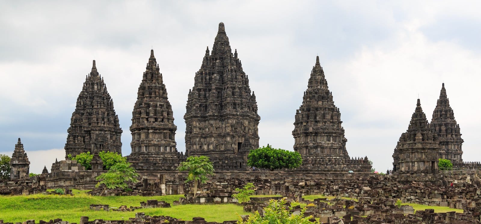 Prambanan Temple towering spires against a bright blue sky in Yogyakarta, Indonesia