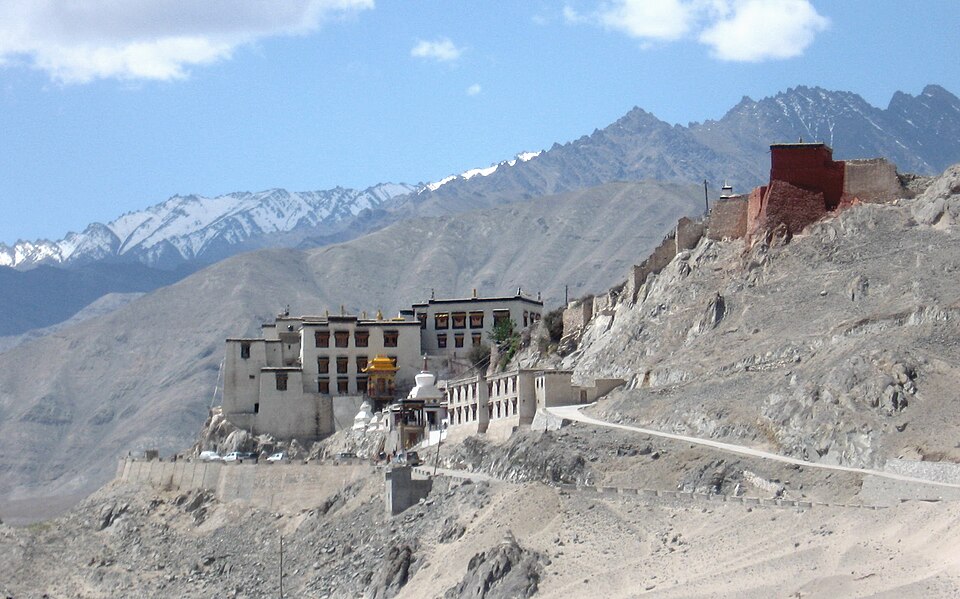 Spituk Monastery perched dramatically atop a conical hill overlooking the Indus Valley.